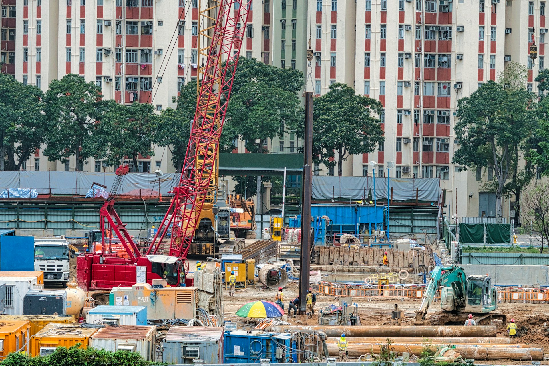 a construction site with a crane in the foreground